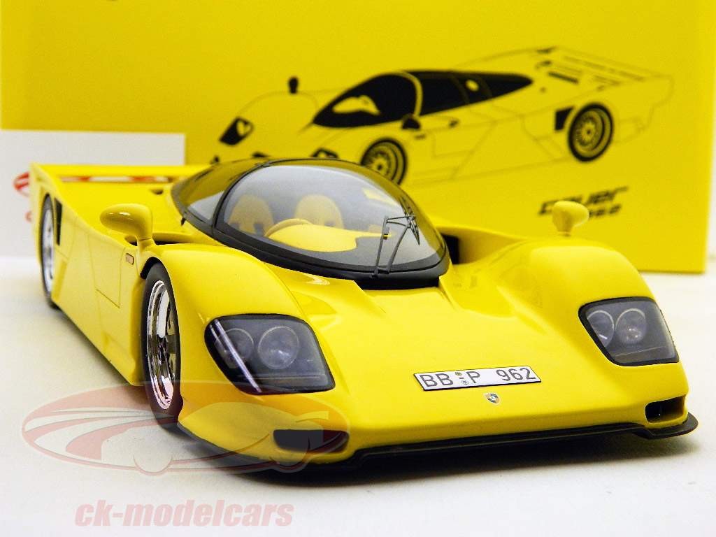 Продолжительность Porsche 962 Дорожная версия желтый / желтый 1:18 Свеча