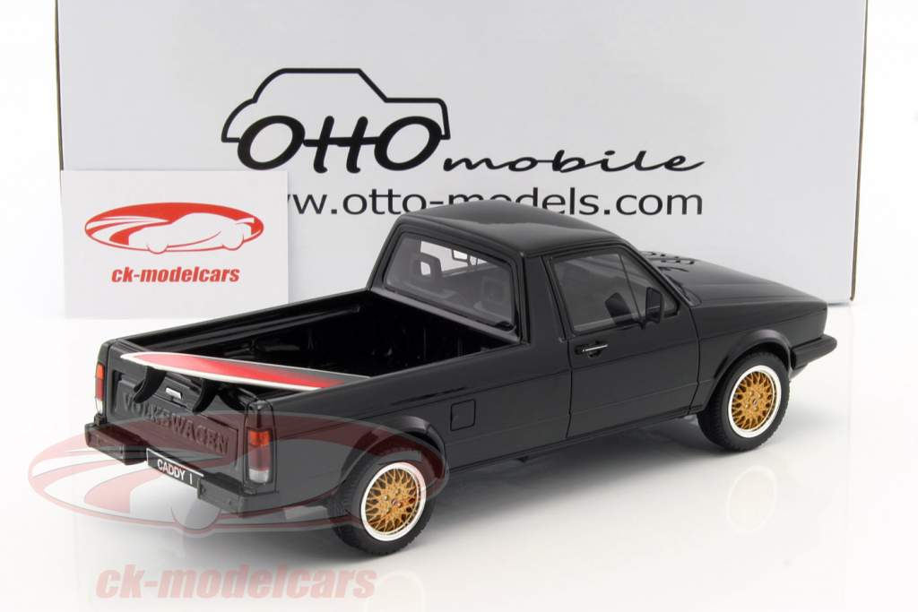 Volkswagen VW Golf Caddy Pick Up with pink surfboard Construction year 1979 black 1:18 OttOmobile