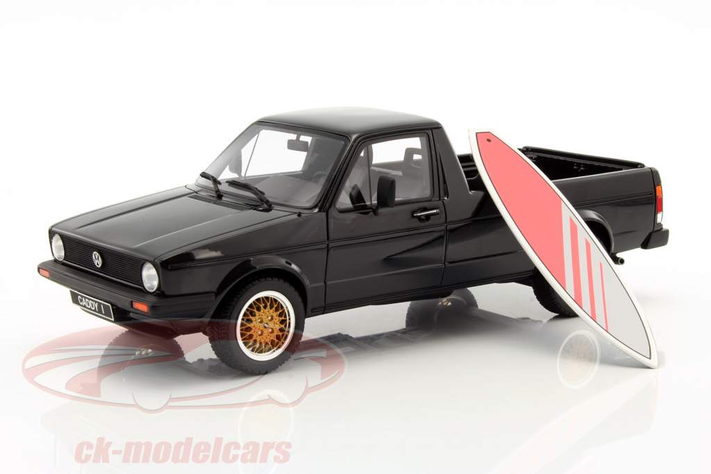 Volkswagen VW Golf Caddy Pick Up with pink surfboard Construction year 1979 black 1:18 OttOmobile