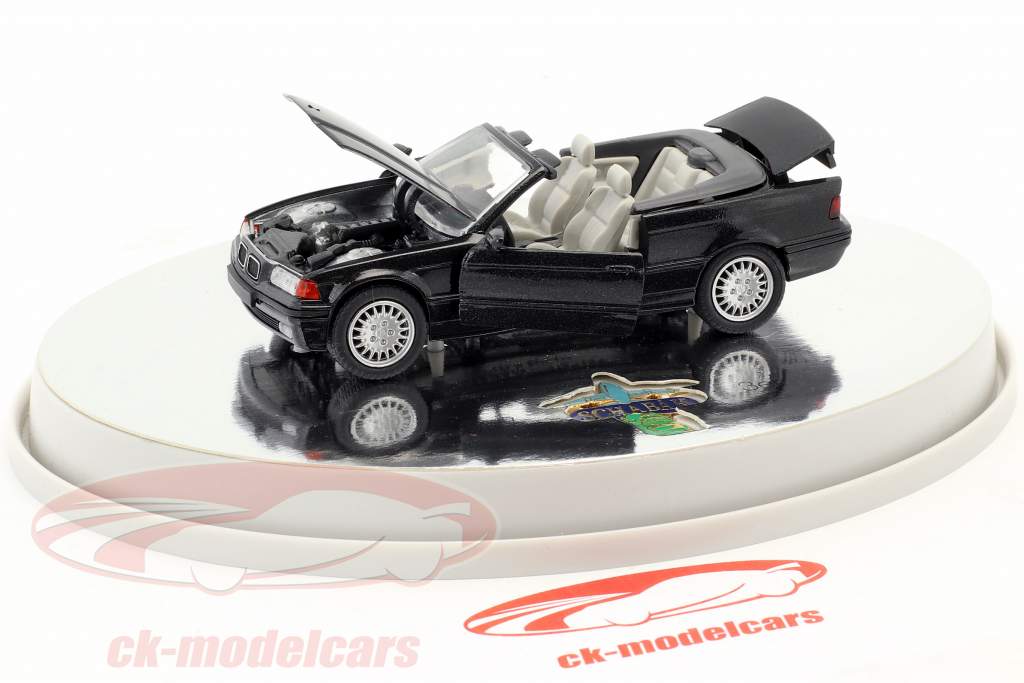 BMW 3er (E36) Cabriolet ano de construção 1993 – 1996 preto metálico com branco interior 1:43 Schabak