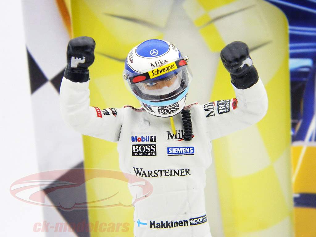 Mika Hakkinen figure formula 1 world champion standing winningfist 1:18 TopMo