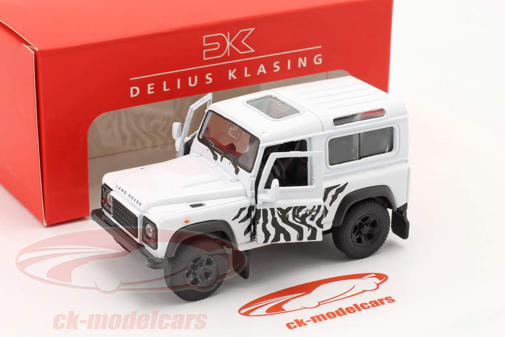Set: Book Landy forever & Land Rover Defender white / black 1:38 Welly