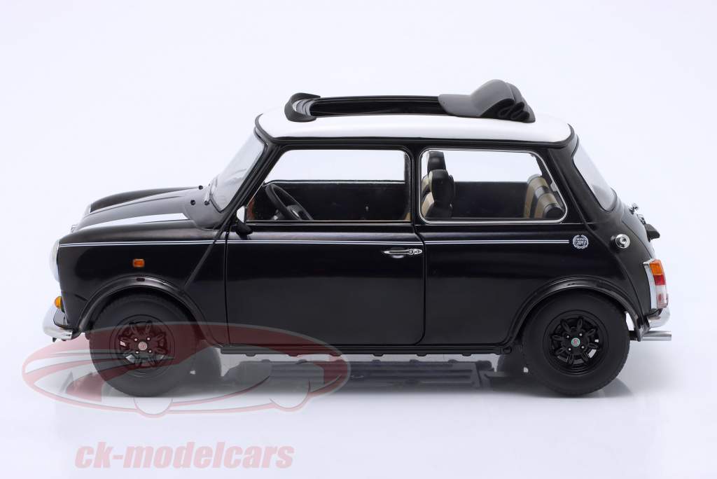 Mini Cooper mit Schiebedach schwarz metallic / weiß LHD 1:12 KK-Scale