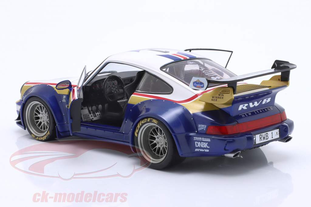 Porsche 911 (964) RWB Rauh-Welt 2022 blå / hvid / rød / guld 1:18 Solido