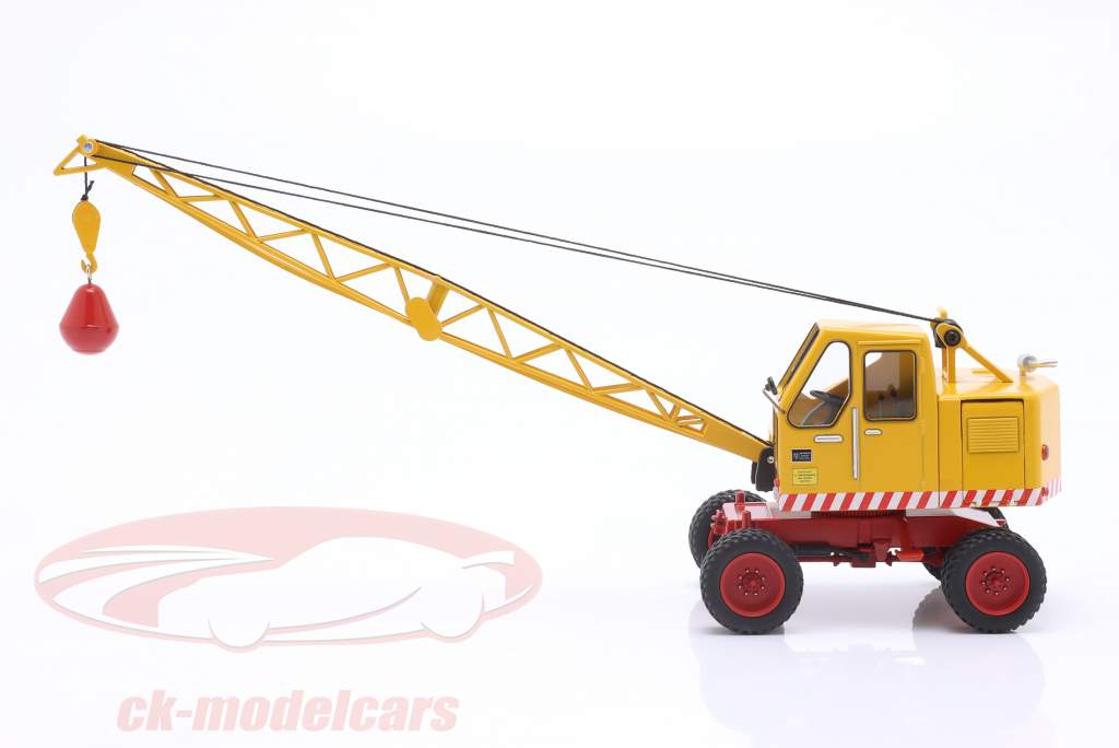 Fuchs graafmachine 301 met schep En sloopkogel geel 1:32 Schuco