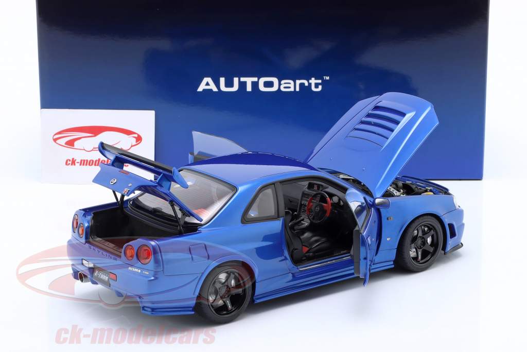 Nissan Skyline GT-R (R34) Nismo Z-Tune 2005 junto a la bahía azul 1:18 AUTOart