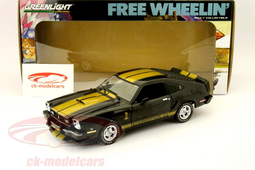 フォードマスタングコブラII 1977ゴールドのストライプの入った黒の1時18分グリーンライト